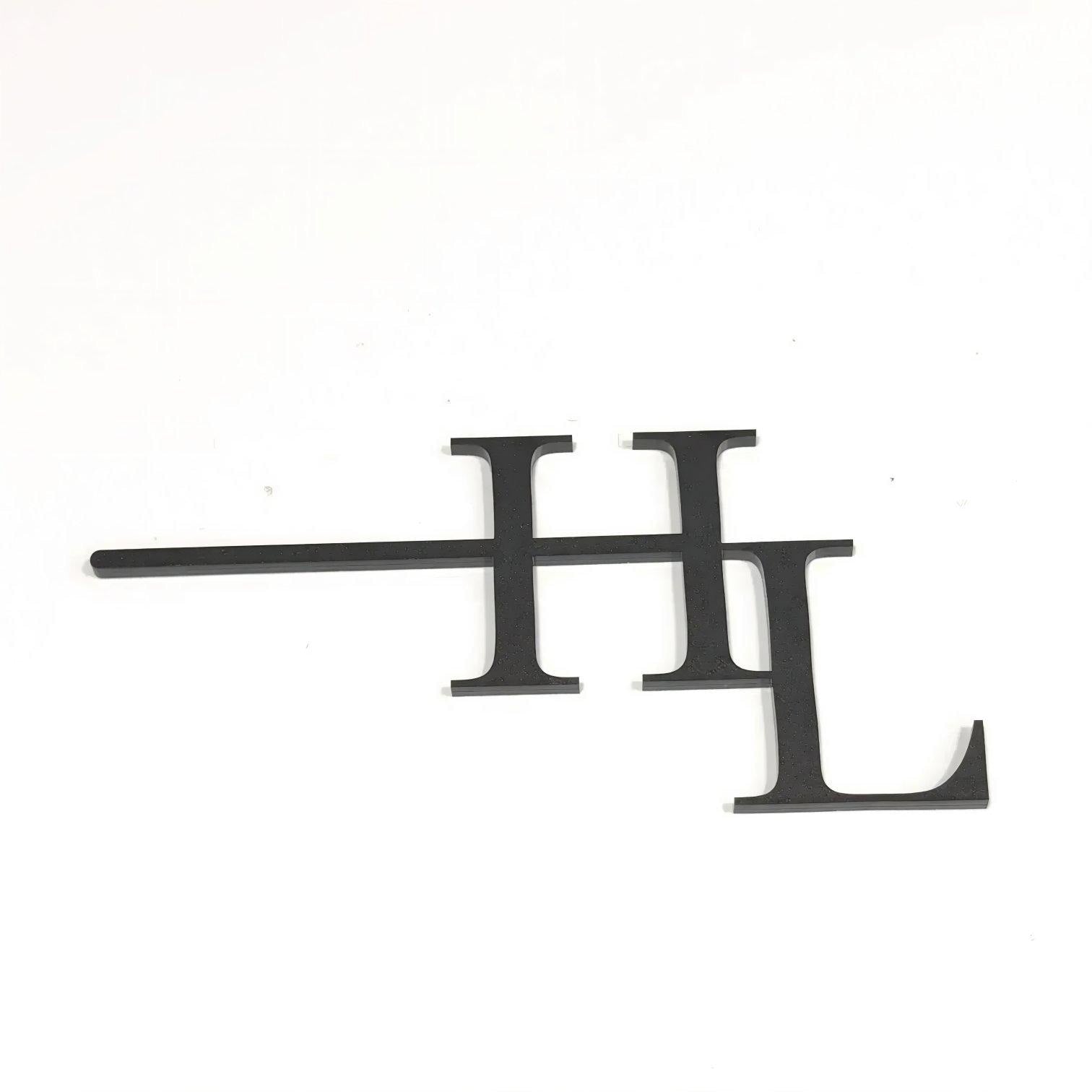 a black symbol resembling a stylized letter 'F' or 'T' on a plain white background.