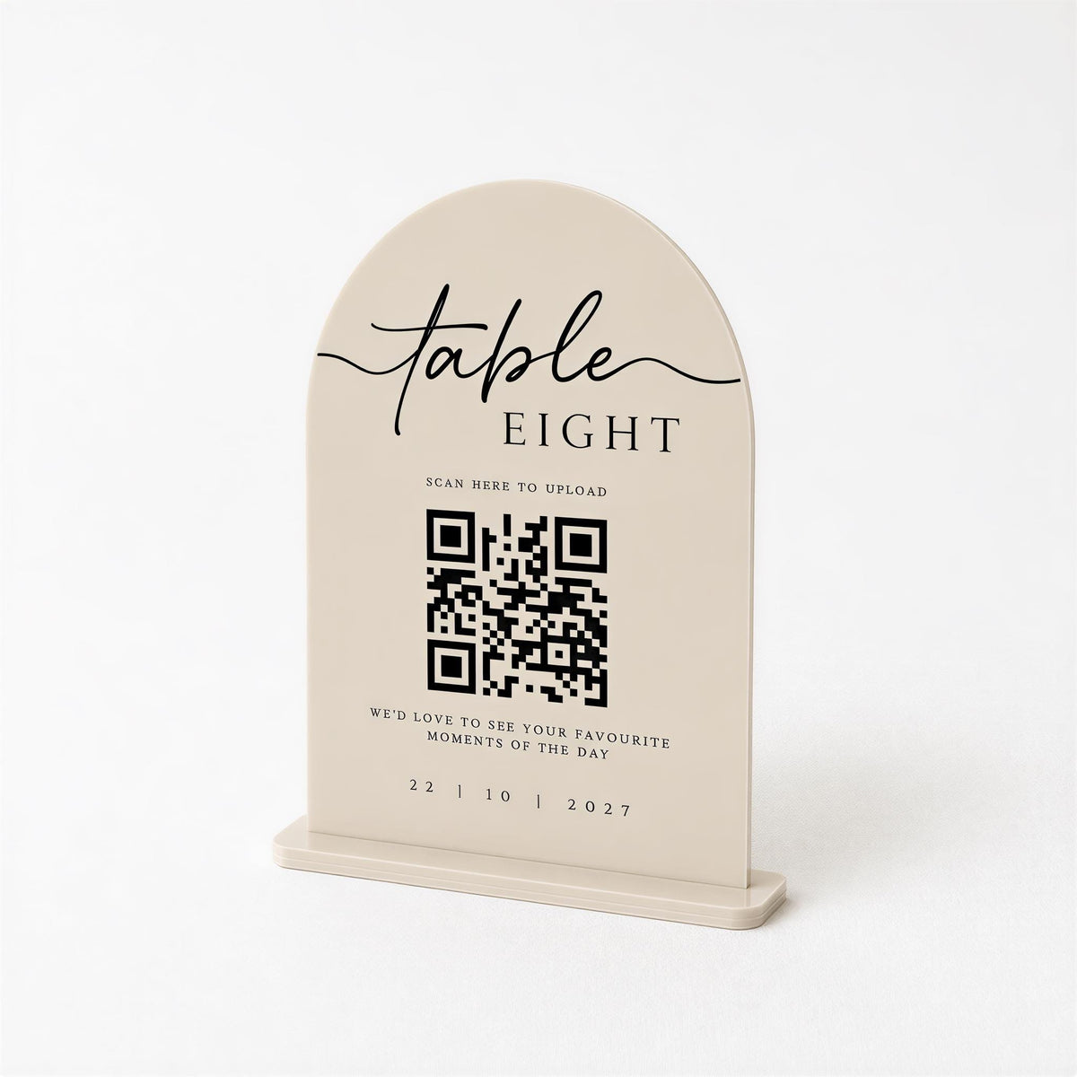 a beige table sign with a QR code and text, including a QR code and text that reads "Table Eight" and "Scan here to upload".