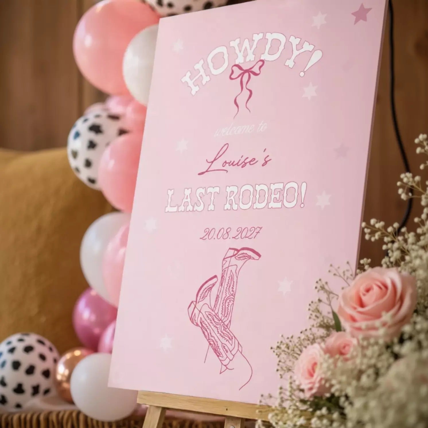A pink sign with white text welcoming guests to a "Last Rodeo" event on August 20, 2017.