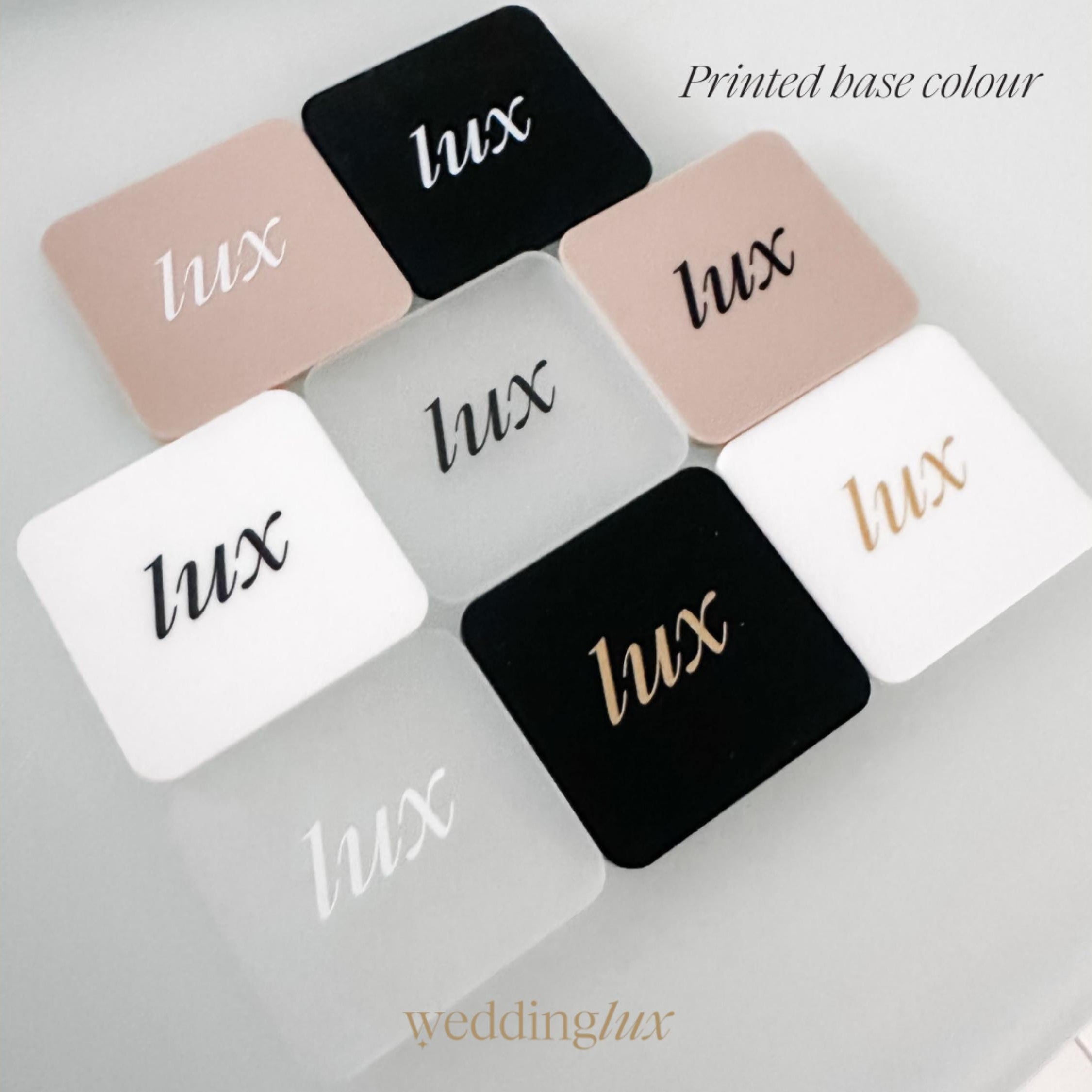 A collection of square-shaped objects with the word "LUX" printed on them, arranged in a grid-like pattern.