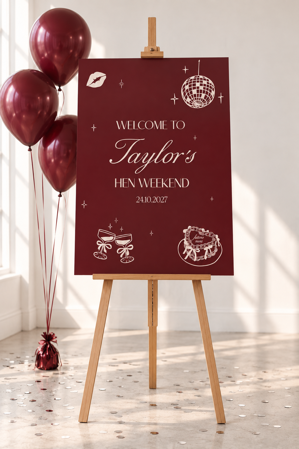 A red sign welcoming guests to Taylor's Hen Weekend, with balloons and a disco ball in the background.