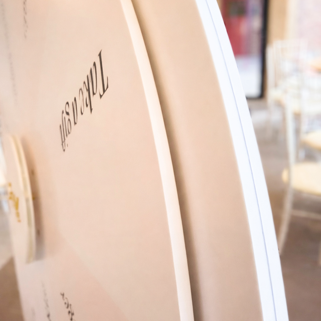 a close-up view of a white, circular object with the text "TAP" visible on it.