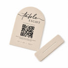 a beige-colored label with a QR code and text, along with a beige-colored object, possibly a paper or a card, placed on a white background.