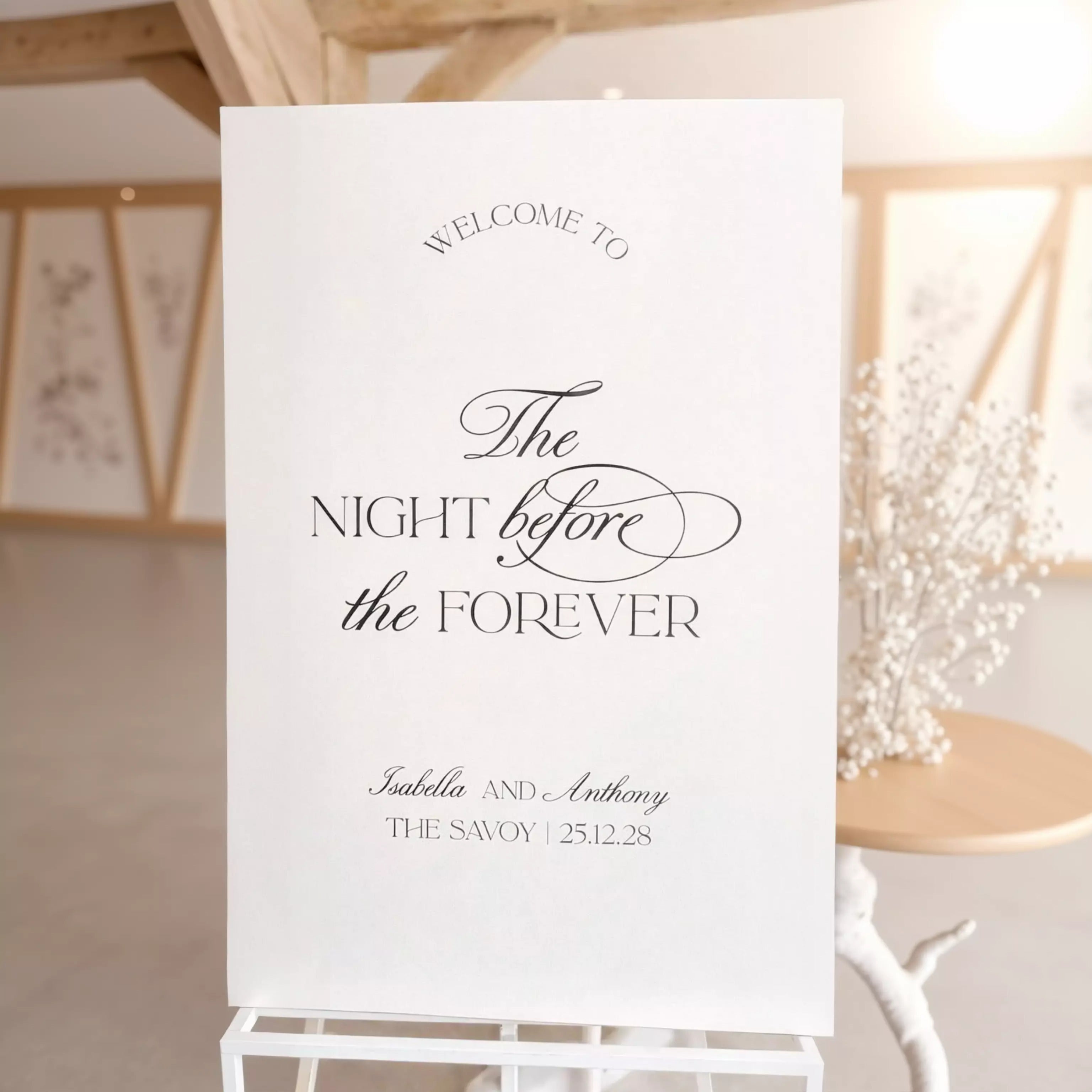 a white sign with black text welcoming guests to an event.