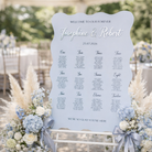 A wedding seating plan sign welcoming guests to the event, with the names Josephine and Robert listed along with their seating assignments.