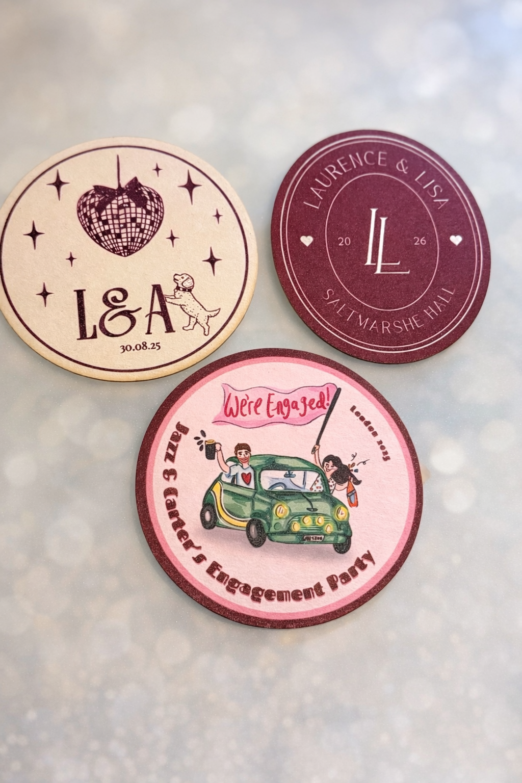 Three circular coasters with different designs and text.