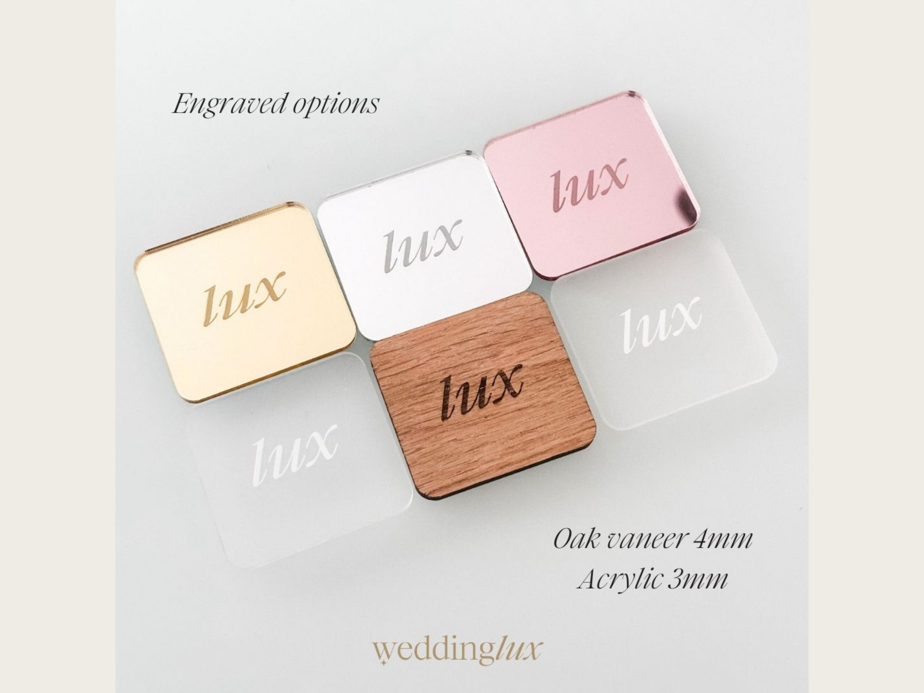 a collection of six square mirrors or photo frames, each with a different color and engraved text. The mirrors are arranged in a grid-like pattern, showcasing the variety of colors and designs available.