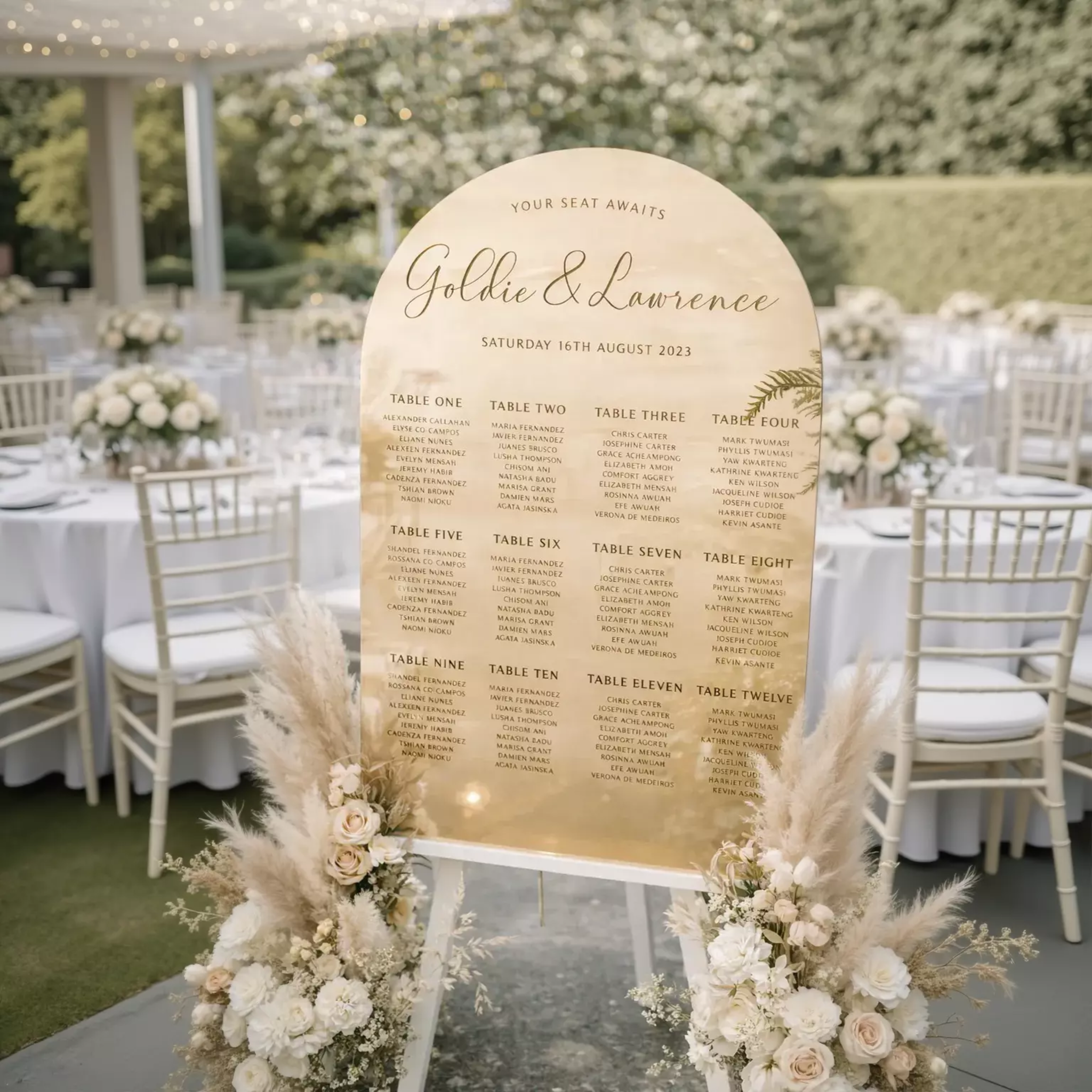 a wedding reception seating plan displayed on a wooden sign.