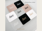 A collection of square-shaped objects with the word "LUX" printed on them, arranged in a grid-like pattern.